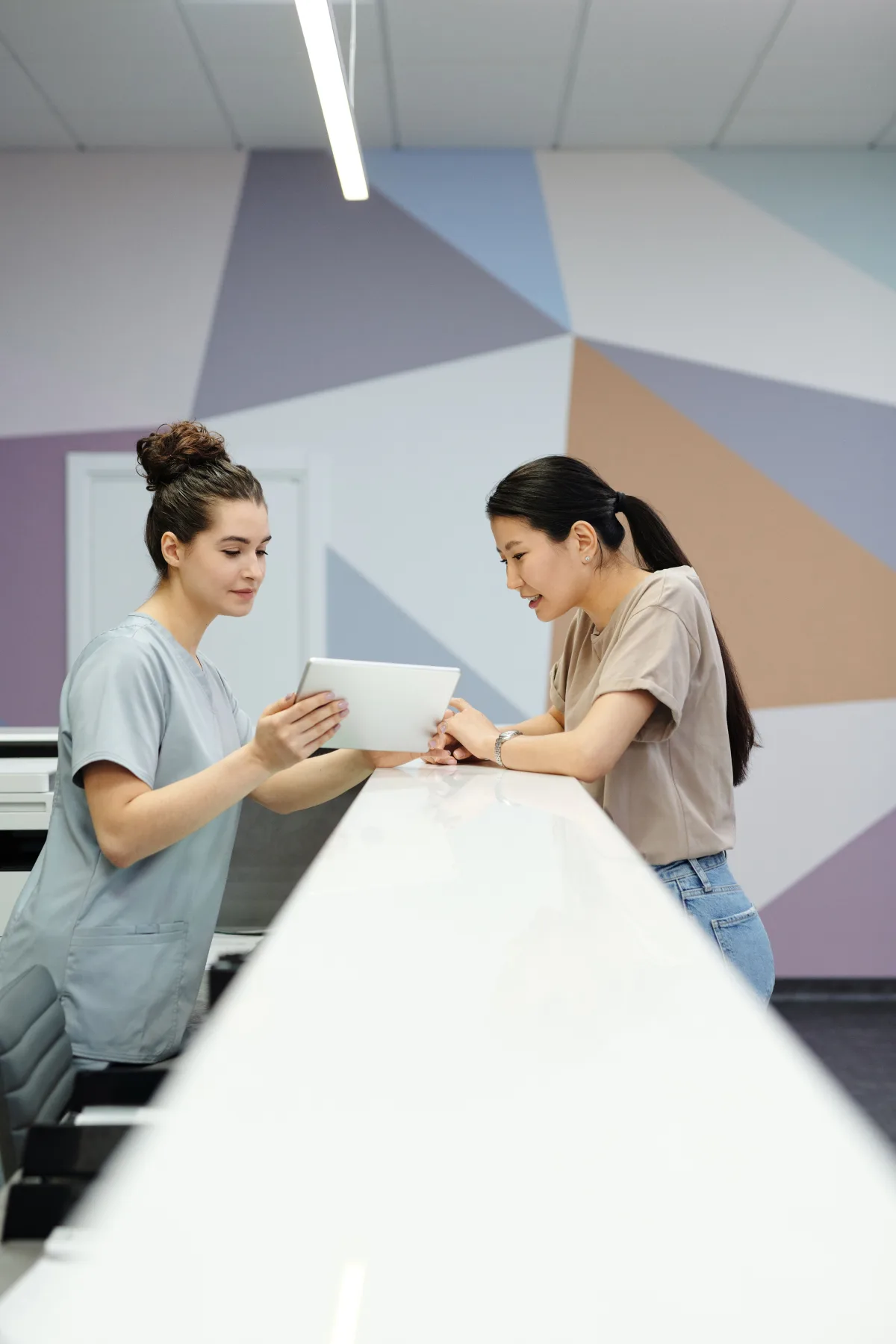 A dental professional discussing treatment with a patient