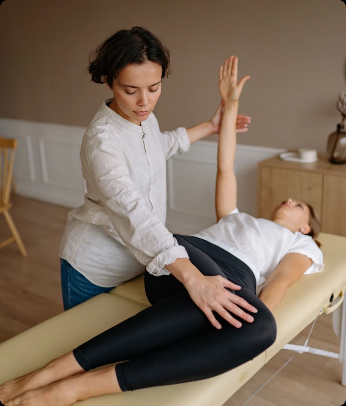 Clinic practitioner supporting a patient