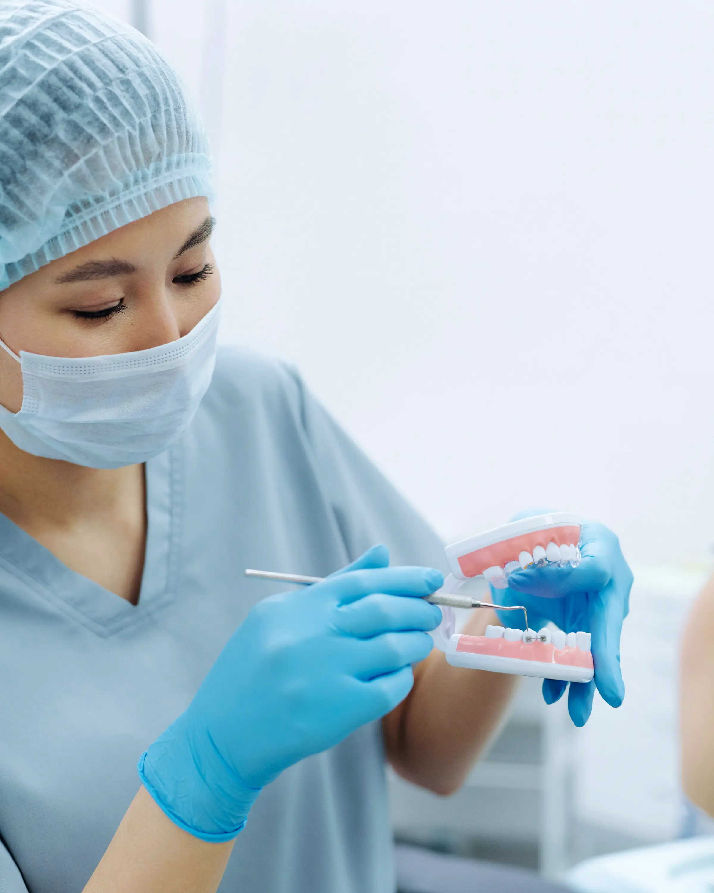 Dental professional preparing treatment